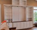 Custom Entertainment Center with book shelves and a rolling ladder