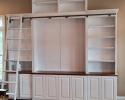 Custom Entertainment Center with book shelves and a rolling ladder