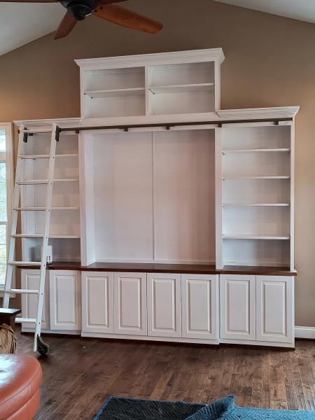 Custom Entertainment Center with book shelves and a rolling ladder
