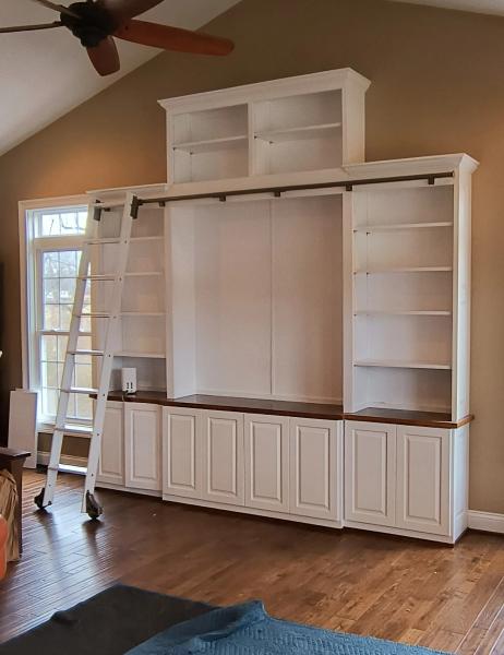 Custom Entertainment Center with book shelves and a rolling ladder